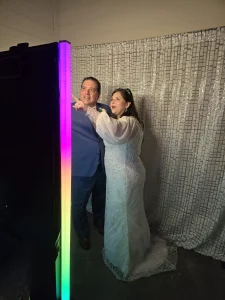 Wedding couple posing in the photo booth by Rumba Houston Photo Booth at a Houston wedding.
